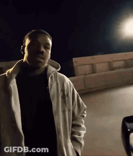 Man In White Jacket And Black Shirt GIF