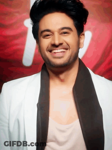 Man In White Jacket And Black Tie Smiling GIF