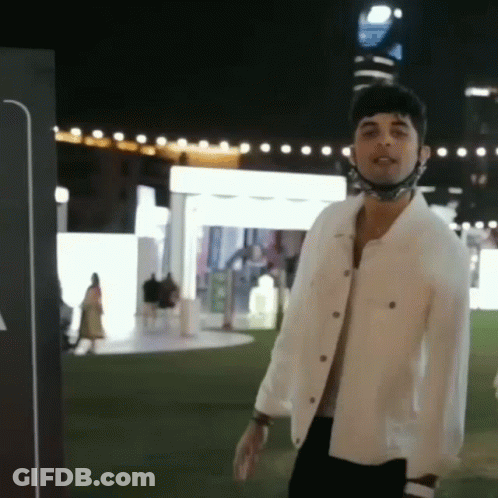 Man In White Jacket And Mask At Night GIF
