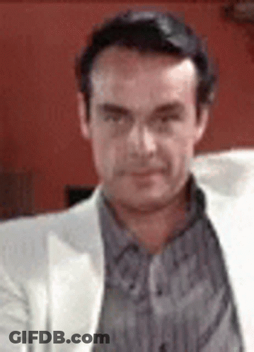 Man In White Jacket And Striped Shirt GIF