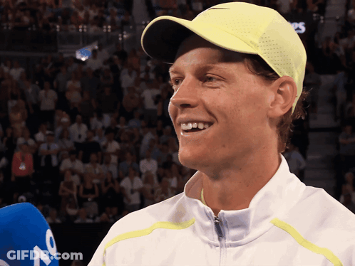 Man In White Jacket And Yellow Hat Smiling GIF