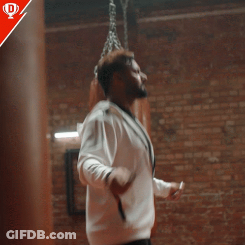 Man In White Jacket By Brick Wall Match Ke Liye Taiyaar GIF