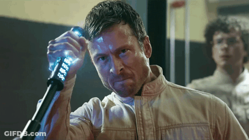 Man In White Jacket Holding Glowing Object GIF