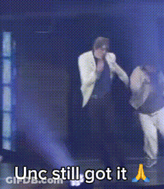 Man In White Jacket Holding Hand Saying Unc Still Got It GIF