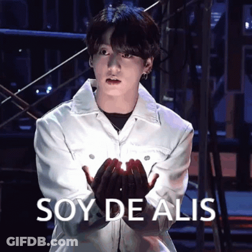 Man In White Jacket Holding Something Soy De Alis GIF