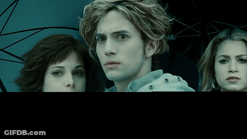 Man In White Jacket Next To Two Women GIF