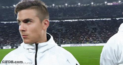 Man In White Jacket On Soccer Field In Front Of Crowd GIF