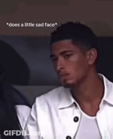 Man In White Jacket Sitting In Car Does A Little Sad Face GIF