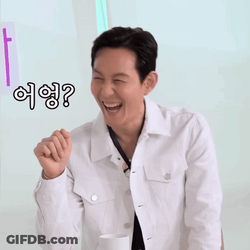 Man In White Jacket Smiling Pointing With Question Mark GIF