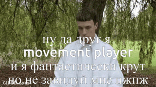 Man In White Jacket Standing Before Tree Saying Movement Player GIF
