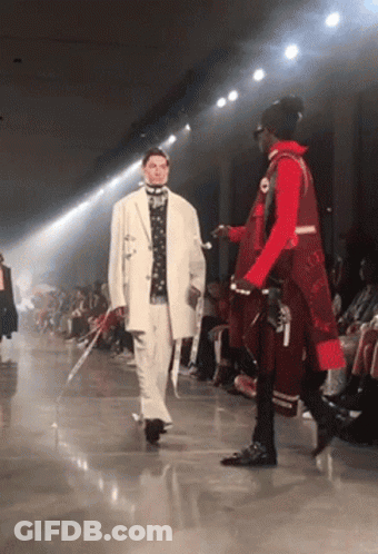 Man In White Jacket Walking Down Runway GIF