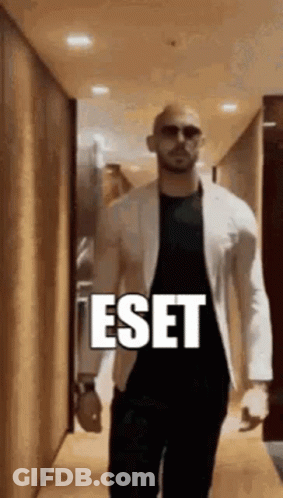 Man In White Jacket Walking Past ESET Sign GIF