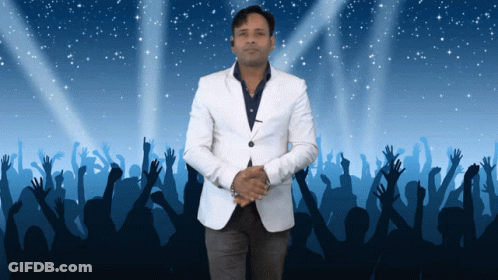 Man In White Jacket With Hands Up In Crowd GIF