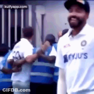 Man In White Jersey Standing Before Crowd GIF