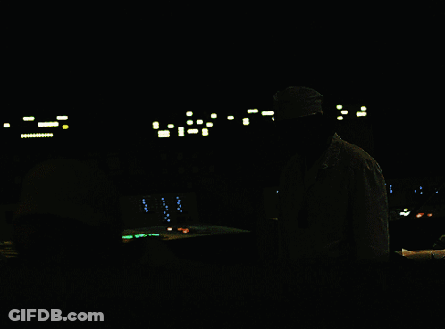 Man In White Lab Coat And Hat In Dark Room GIF