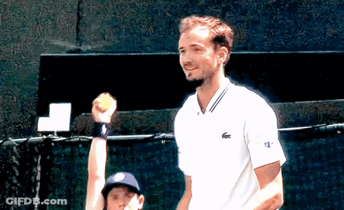 Man In White Lacoste Shirt Holding Tennis Ball GIF
