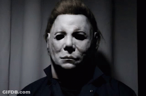Man In White Mask And Black Shirt GIF