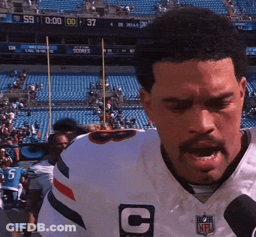 Man In White NFL Jersey With Letter C GIF