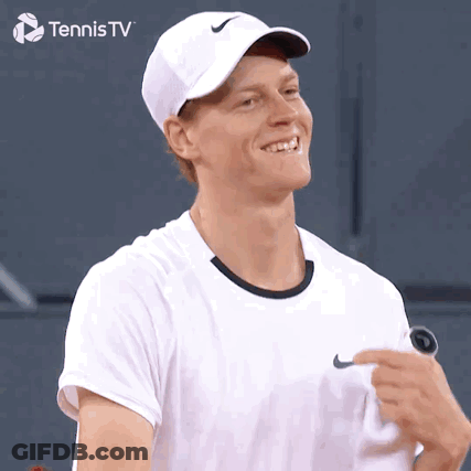 Man In White Nike Hat Smiling Holding Tennis Racquet GIF