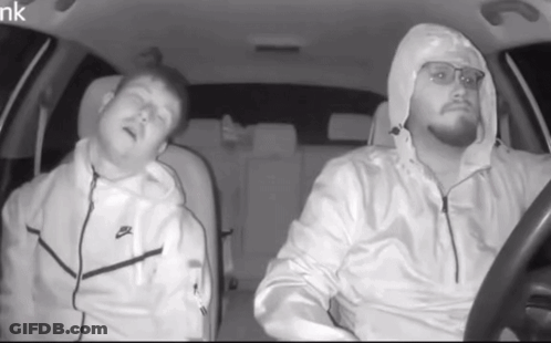 Man In White Nike Jacket Driving Car GIF