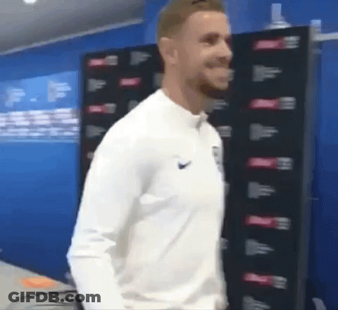 Man In White Nike Shirt In Blue Room GIF
