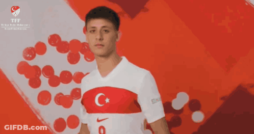 Man In White Nike Shirt With C And Star GIF