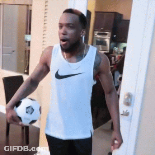 Man In White Nike Tank Top Holding Soccer Ball GIF