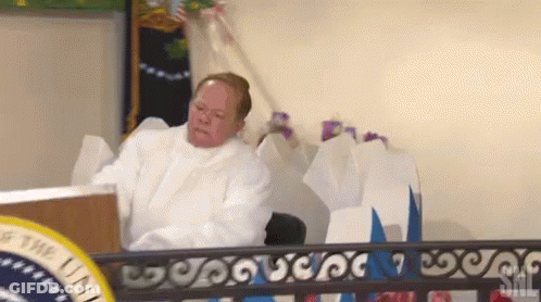 Man In White Robe At Podium GIF
