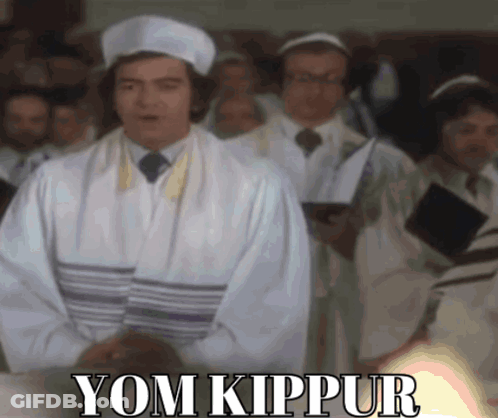 Man In White Robe Before Crowd Saying Yom Kippur GIF