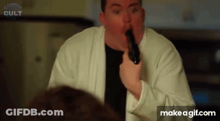 Man In White Robe Holding Gun Funny Face GIF