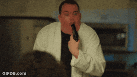 Man In White Robe Holding Gun In Mouth GIF