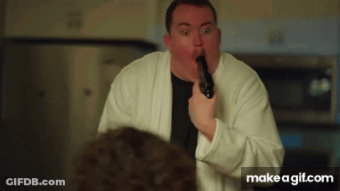 Man In White Robe Holding Gun GIF