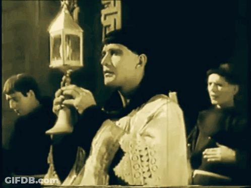 Man In White Robe Holding Lantern GIF
