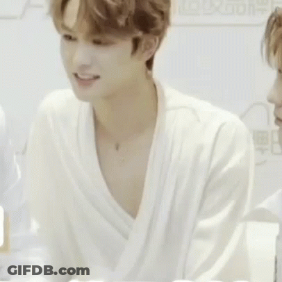 Man In White Robe Looking At Another Man GIF