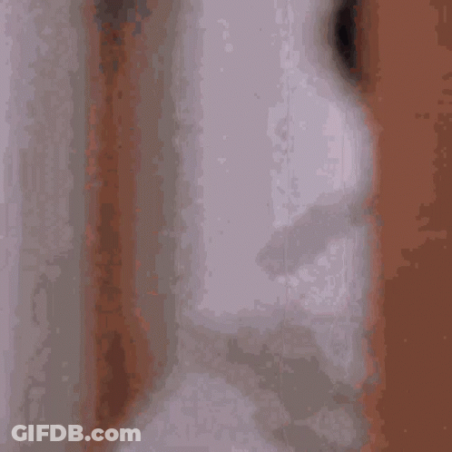 Man In White Robe Looking Out GIF
