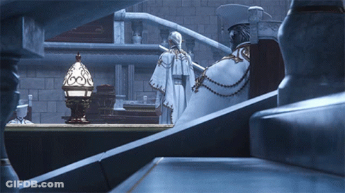 Man In White Robe Next To Woman In Cape GIF