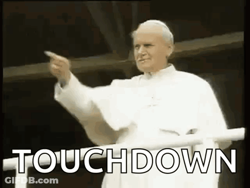 Man In White Robe Pointing GIF