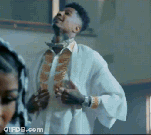 Man In White Robe Standing In Room GIF