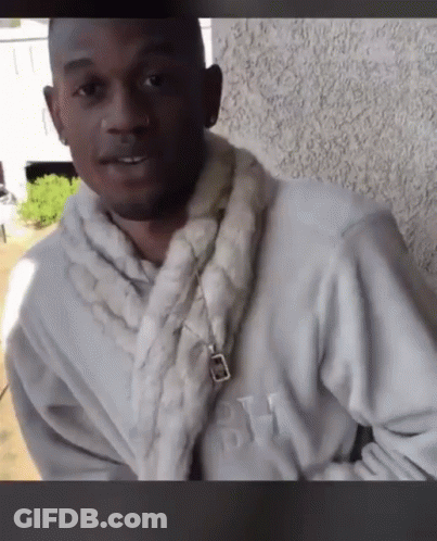 Man In White Robe With Letter H GIF