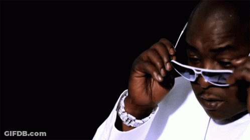 Man In White Shirt Adjusting Sunglasses GIF