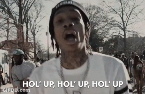 Man In White Shirt And Black Hat Says Hol Up GIF