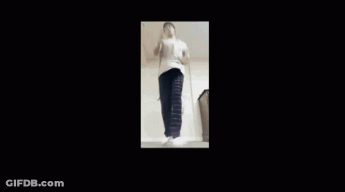 Man In White Shirt And Black Pants Dancing GIF