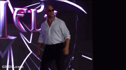 Man In White Shirt And Black Pants In Front Of Jets Sign GIF