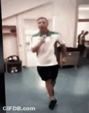 Man In White Shirt And Black Shorts Running GIF