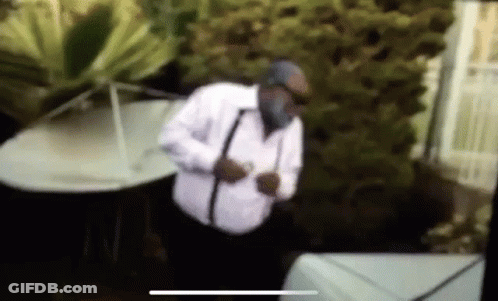 Man In White Shirt And Black Suspenders At Piano GIF