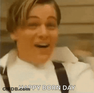 Man In White Shirt And Black Suspenders Says Happy Born Day GIF