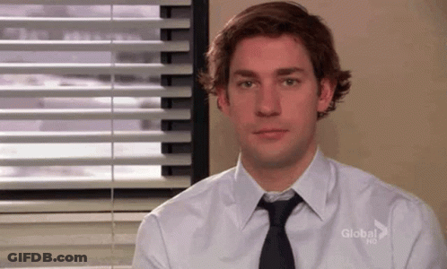 Man In White Shirt And Black Tie At Window GIF