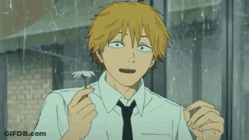Man In White Shirt And Black Tie Holding Flower GIF