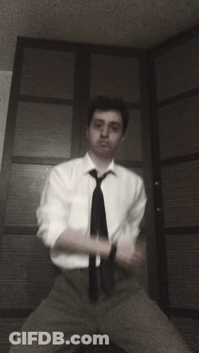 Man In White Shirt And Black Tie GIF