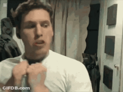 Man In White Shirt And Black Tie Looking In Mirror GIF